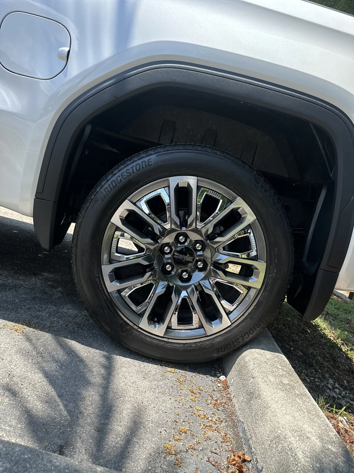 Close view of a GMC wheel and surrounding bodywork