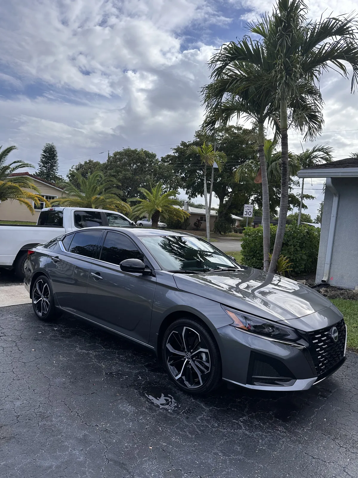 Nissan Altima outside a South Florida home in the Madan portfolio